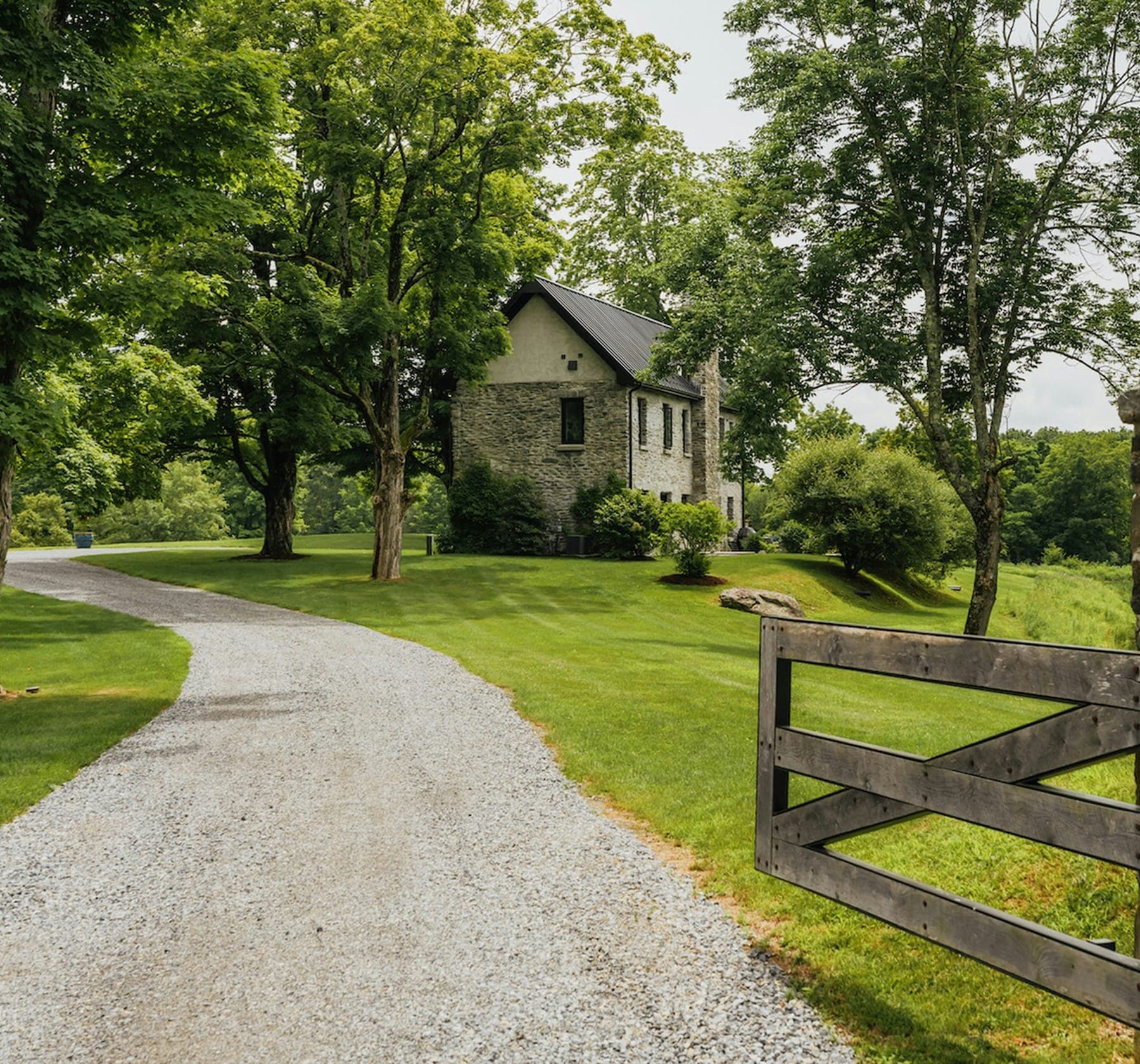 Stone home and gravel driveway in El Dorado County.