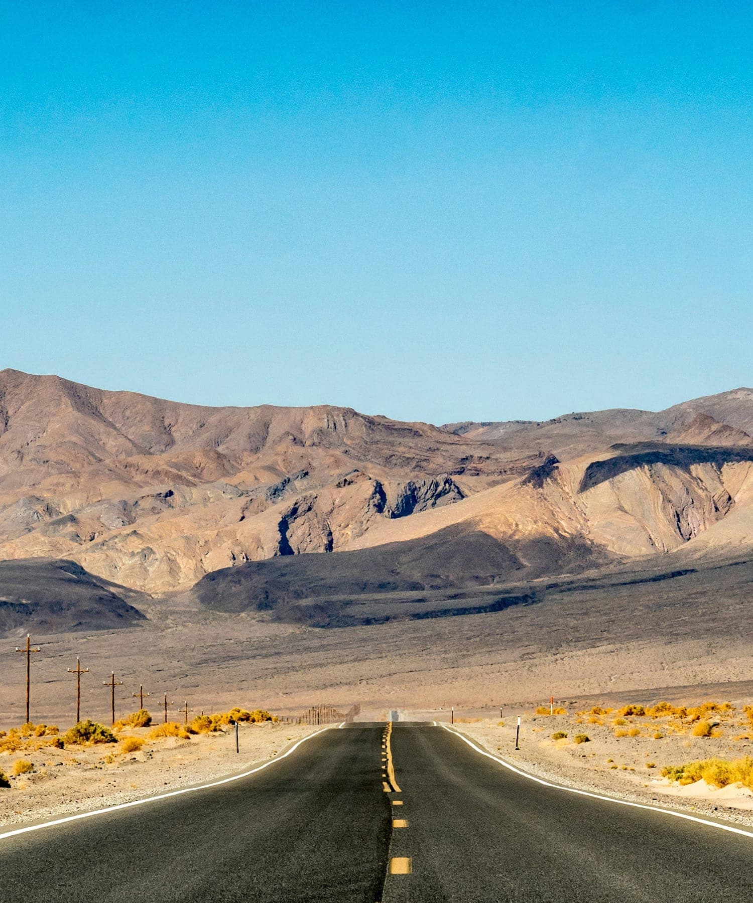 Valley road with buttes in Sutter County.