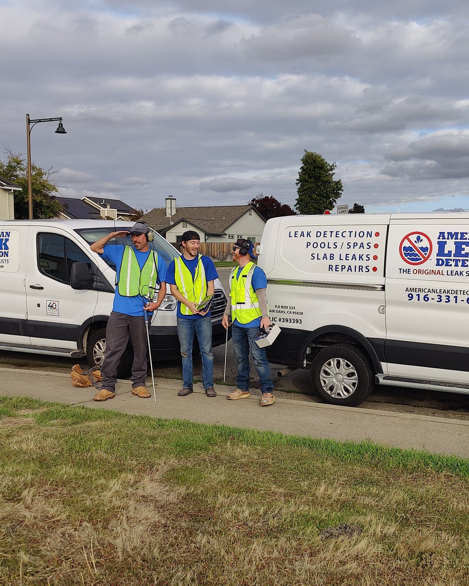 American Leak Detection crew standing beside a service van during a Yolo County leak detection call.