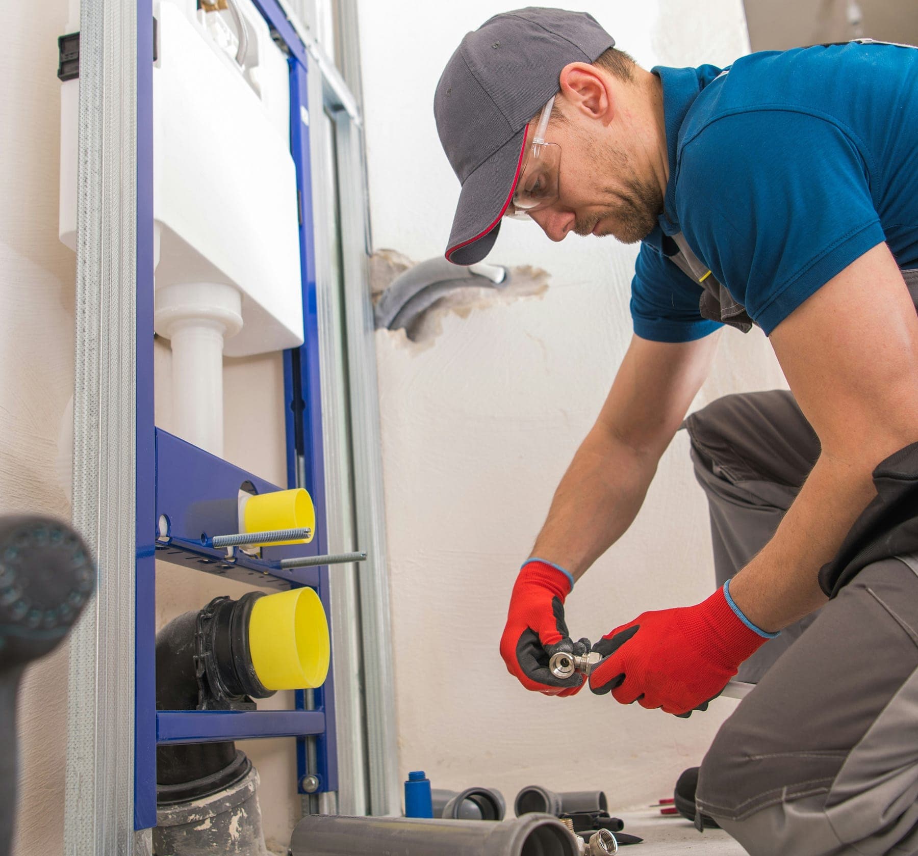 Technician working on interior plumbing during a Yuba County leak diagnostic visit.