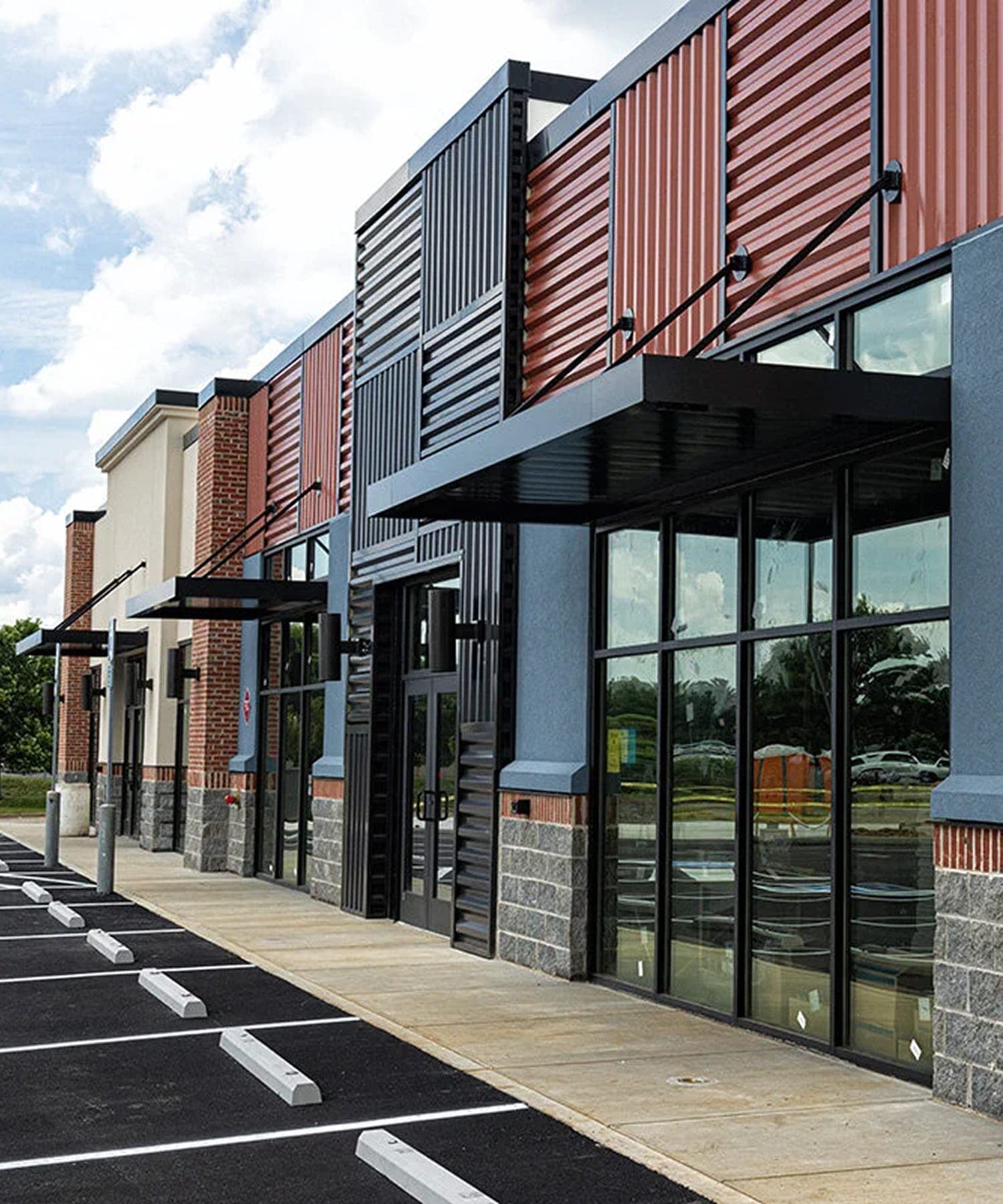 Commercial building exterior during a leak diagnostic visit.