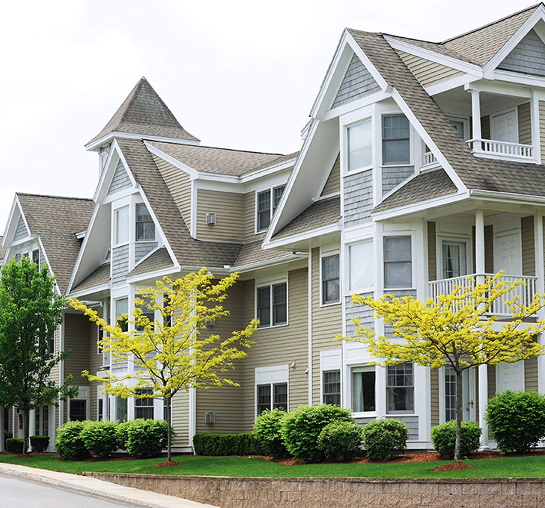 Multifamily building exterior during a plumbing diagnostic visit.