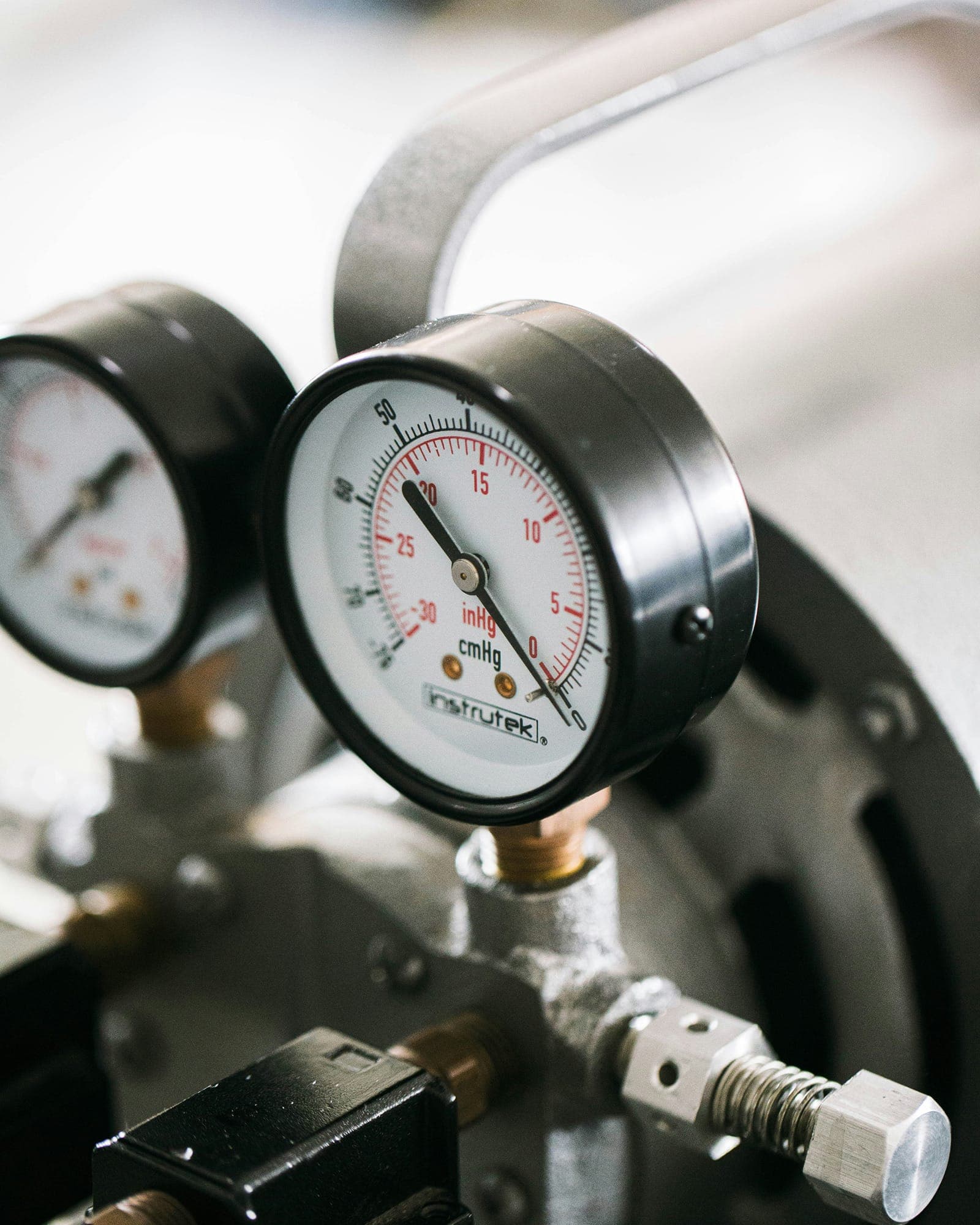 Close-up of a pressure gauge during leak isolation testing.