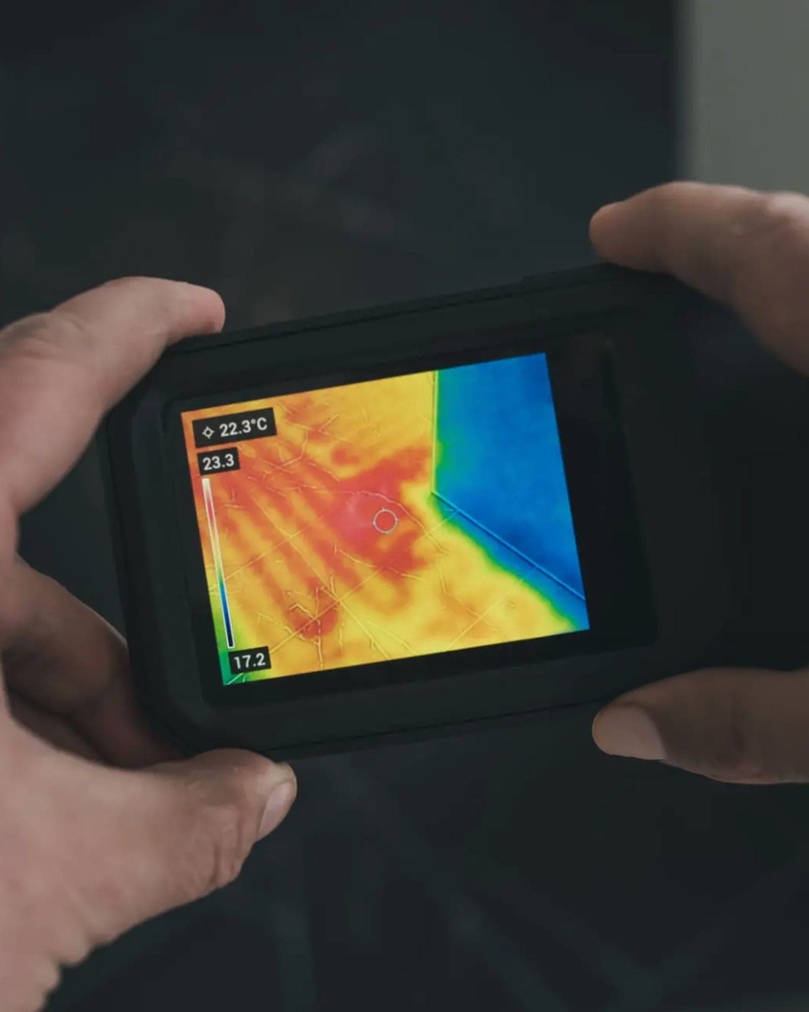 Thermal camera showing a heat signature across a finished floor.